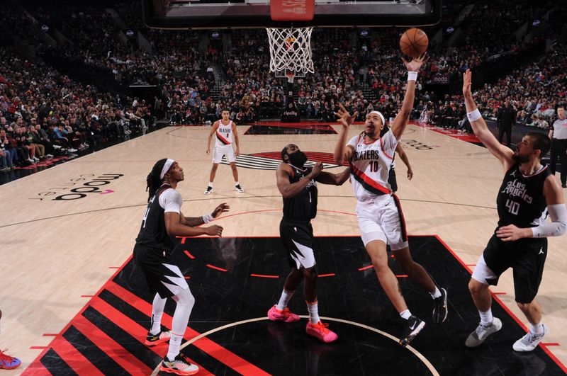 PORTLAND, OR - MARCH 22:  Moses Brown #10 of the Portland Trail Blazers goes to the basket during the game on March 22, 2024 at the Moda Center Arena in Portland, Oregon. NOTE TO USER: User expressly acknowledges and agrees that, by downloading and or using this photograph, user is consenting to the terms and conditions of the Getty Images License Agreement. Mandatory Copyright Notice: Copyright 2024 NBAE (Photo by Cameron Browne/NBAE via Getty Images)