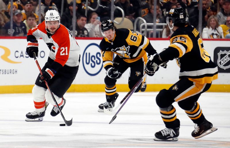 Feb 25, 2024; Pittsburgh, Pennsylvania, USA;  Philadelphia Flyers center Scott Laughton (21) skates spice with the puck against the Pittsburgh Penguins during the third period at PPG Paints Arena.  Pittsburgh won 7-6. Mandatory Credit: Charles LeClaire-USA TODAY Sports