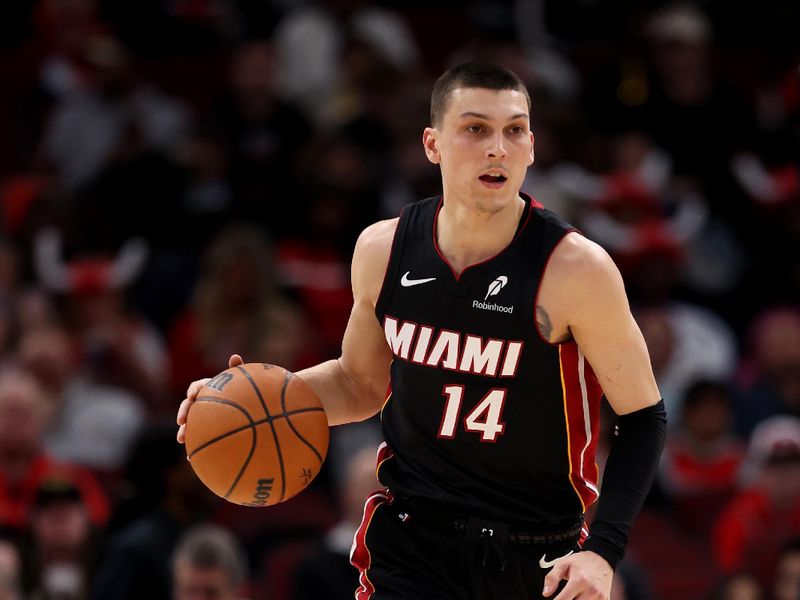 CHICAGO, ILLINOIS - FEBRUARY 04: Tyler Herro #14 of the Miami Heat in action against the Chicago Bulls at the United Center on February 04, 2025 in Chicago, Illinois. NOTE TO USER: User expressly acknowledges and agrees that, by downloading and or using this photograph, user is consenting to the terms and conditions of the Getty Images License Agreement.  (Photo by Luke Hales/Getty Images)