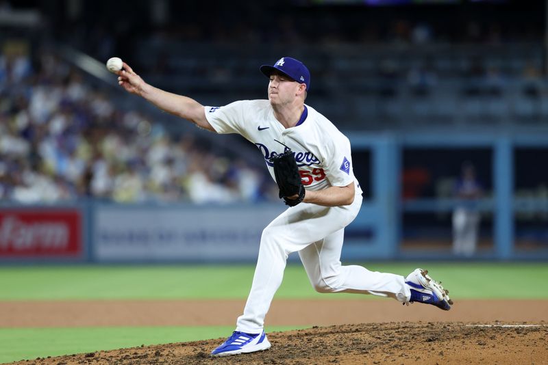 Sep 10, 2024; Los Angeles, California, USA;  Los Angeles Dodgers relief pitcher Evan Phillips (59) pitches during the eighth inning against the Chicago Cubs at Dodger Stadium. Mandatory Credit: Kiyoshi Mio-Imagn Images