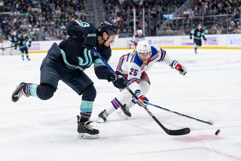 Nov 17, 2022; Seattle, Washington, USA; Seattle Kraken forward Brandon Tanev (13) takes a shot against New York Rangersdefenseman Libor Hajek (25) during the third period at Climate Pledge Arena. Mandatory Credit: Stephen Brashear-USA TODAY Sports