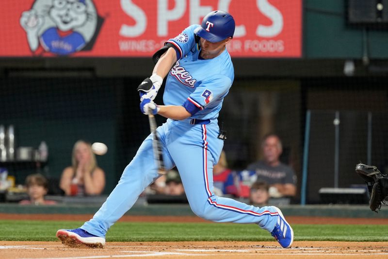 Jun 23, 2024; Arlington, Texas, USA; Texas Rangers shortstop Corey Seager (5) connects for a double against the Kansas City Royals during the first inning at Globe Life Field. Mandatory Credit: Jim Cowsert-USA TODAY Sports