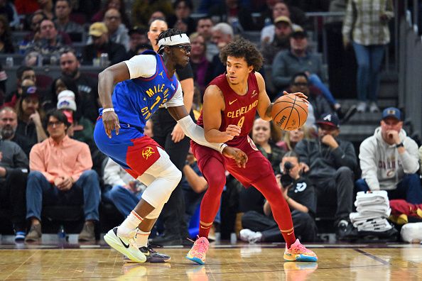 CLEVELAND, OHIO - NOVEMBER 19: Craig Porter #9 of the Cleveland Cavaliers posts up against Reggie Jackson #7 of the Denver Nuggets during the second quarter at Rocket Mortgage Fieldhouse on November 19, 2023 in Cleveland, Ohio. NOTE TO USER: User expressly acknowledges and agrees that, by downloading and or using this photograph, User is consenting to the terms and conditions of the Getty Images License Agreement. (Photo by Jason Miller/Getty Images)