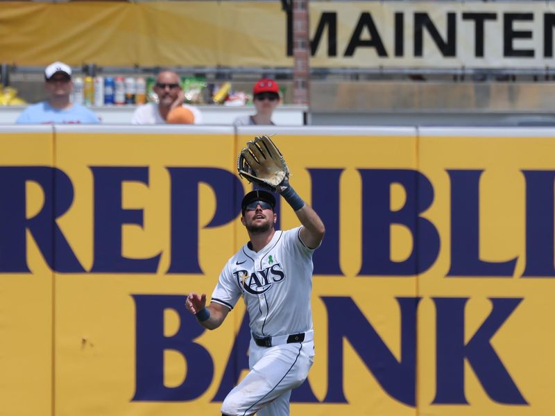 May 28, 2025; Tampa, FL, USA;  Tampa Bay Rays outfielder Josh Lowe (15) catches a fly balll during the seventh inning against the Minnesota Twins at George M. Steinbrenner Field. Mandatory Credit: Kim Klement Neitzel-Imagn Images