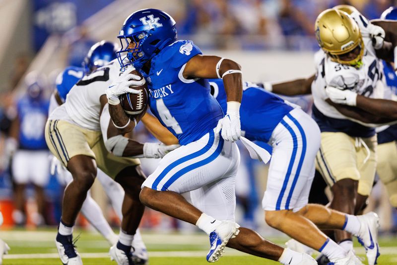 Sep 16, 2023; Lexington, Kentucky, USA; Kentucky Wildcats running back JuTahn McClain (4) carries the ball during the first quarter against the Akron Zips at Kroger Field. Mandatory Credit: Jordan Prather-USA TODAY Sports