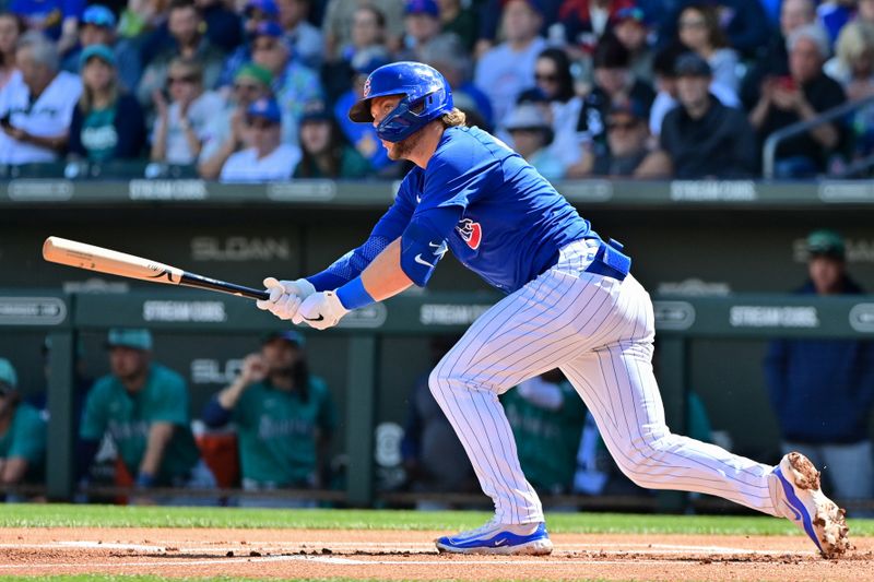 Mar 8, 2024; Mesa, Arizona, USA;  Chicago Cubs second baseman Nico Hoerner (2) lines out in the first inning against the Seattle Mariners during a spring training game at Sloan Park. Mandatory Credit: Matt Kartozian-USA TODAY Sports