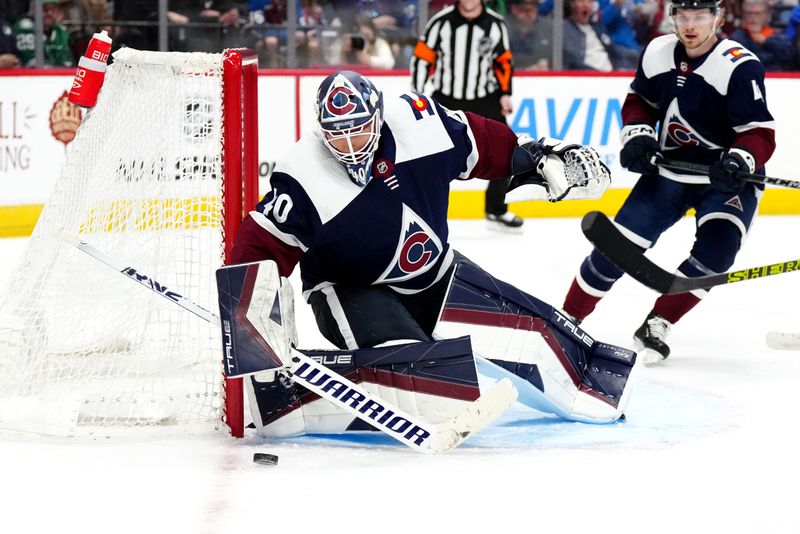 Feb 27, 2024; Denver, Colorado, USA; Colorado Avalanche goaltender Alexandar Georgiev (40) makes a save in the third period against the Dallas Stars at Ball Arena. Mandatory Credit: Ron Chenoy-USA TODAY Sports