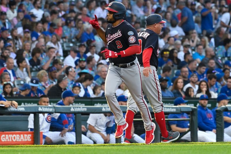 Jul 17, 2023; Chicago, Illinois, USA;  Washington Nationals third baseman Jeimer Candelario (9) points after he hits a two-run home run against the Chicago Cubs during the first inning at Wrigley Field. Mandatory Credit: Matt Marton-USA TODAY Sports