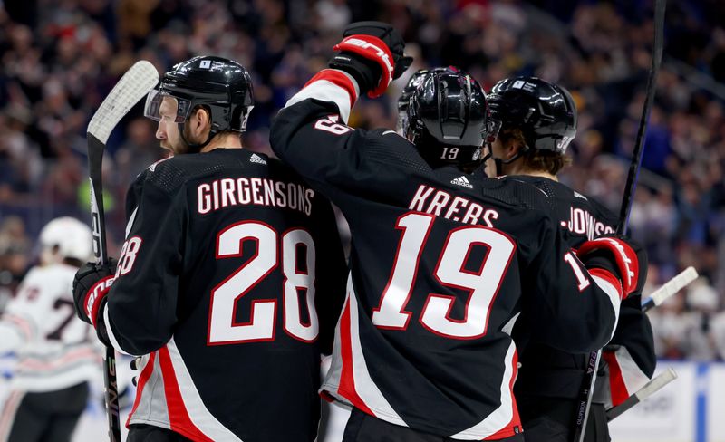 Jan 18, 2024; Buffalo, New York, USA;  Buffalo Sabres left wing Zemgus Girgensons (28) celebrates his goal with teammates during the second period against the Chicago Blackhawks at KeyBank Center. Mandatory Credit: Timothy T. Ludwig-USA TODAY Sports