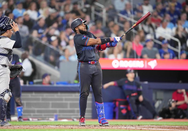 Jun 28, 2024; Toronto, Ontario, CAN; Toronto Blue Jays first baseman Vladimir Guerrero Jr. (27) reacts after hitting a home run against the New York Yankees during the seventh inning at Rogers Centre. Mandatory Credit: Nick Turchiaro-USA TODAY Sports