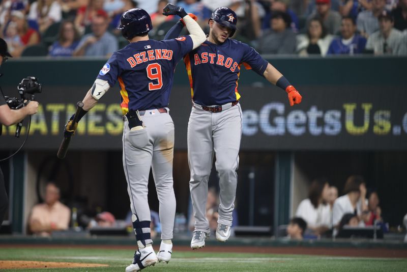 May 18, 2025; Arlington, Texas, USA; Houston Astros outfielder Zach Dezenzo (9) congratulates catcher Yainer Diaz (21) after a home run during the seventh inning against the Texas Rangers at Globe Life Field. Mandatory Credit: Tim Heitman-Imagn Images
