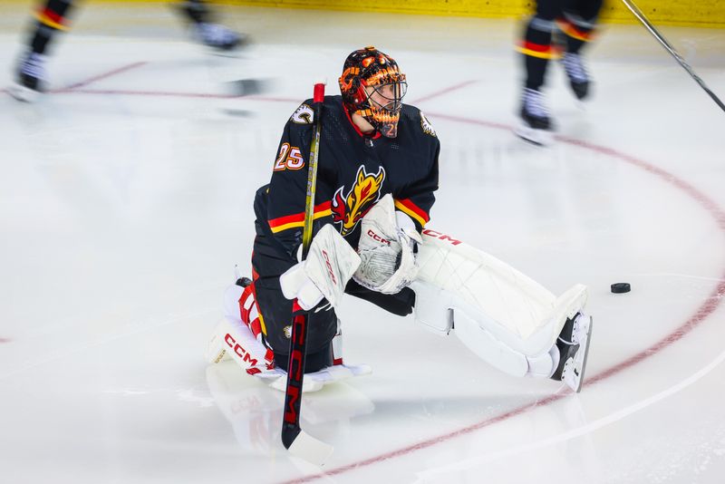 Jan 23, 2024; Calgary, Alberta, CAN; Calgary Flames goaltender Jacob Markstrom (25) during the warmup period against the St. Louis Blues at Scotiabank Saddledome. Mandatory Credit: Sergei Belski-USA TODAY Sports