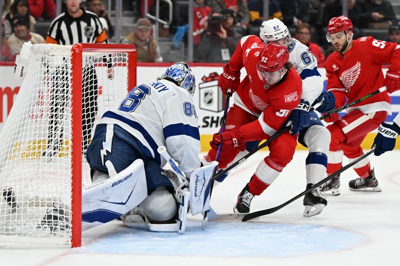 Nov 28, 2025; Detroit, Michigan, USA; Tampa Bay Lightning goaltender Andrei Vasilevskiy (88) blocks a shot on goal from Detroit Red Wings center Marco Kasper (92) in the second period at Little Caesars Arena. Mandatory Credit: Lon Horwedel-Imagn Images