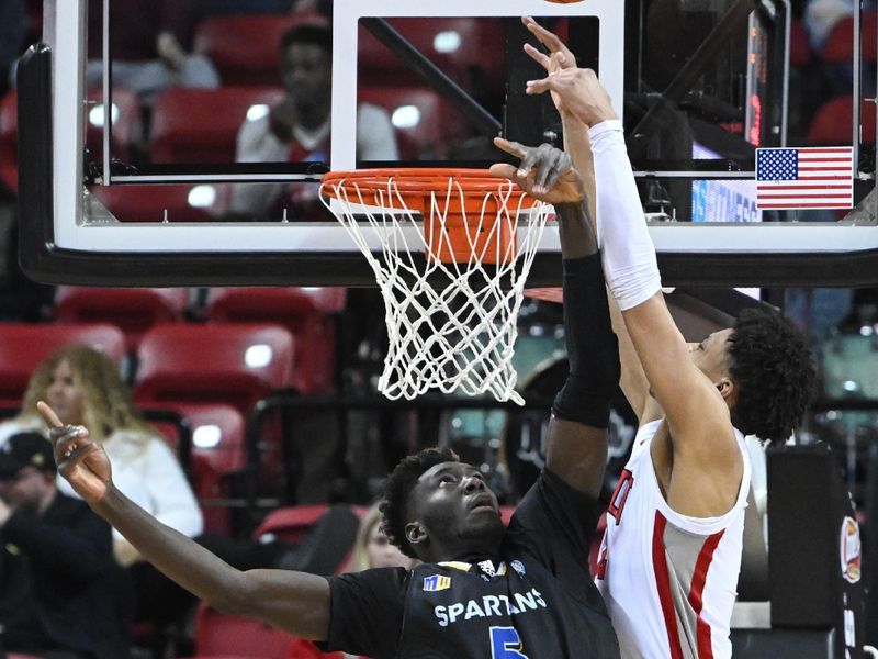 Feb 14, 2023; Las Vegas, Nevada, USA; San Jose State Spartans center Ibrahima Diallo (5) stops a shot from UNLV Runnin' Rebels center David Muoka (12) in the second half at Thomas & Mack Center. Mandatory Credit: Candice Ward-USA TODAY Sports