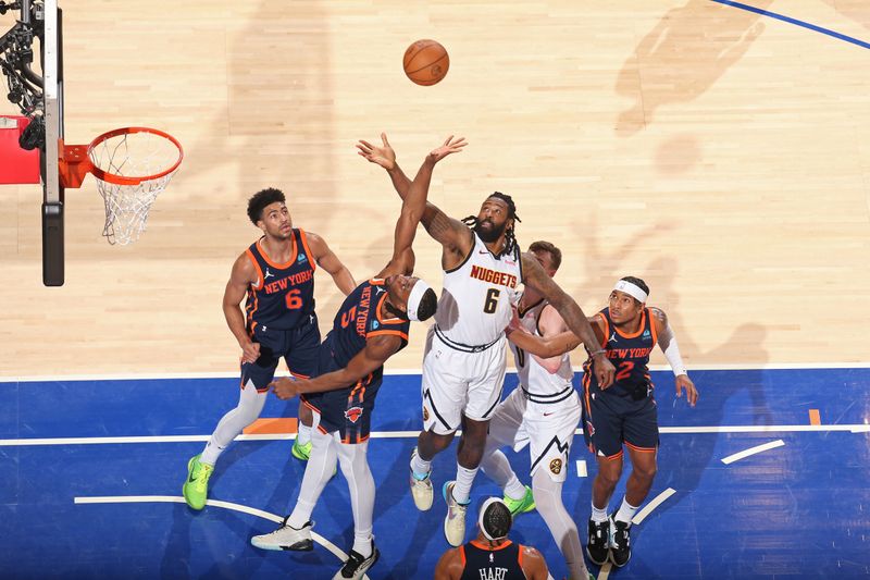 NEW YORK, NY - JANUARY 25: Precious Achiuwa #5 of the New York Knicks and DeAndre Jordan #6 of the Denver Nuggets go for rebound during the game on January 25, 2024 at Madison Square Garden in New York City, New York.  NOTE TO USER: User expressly acknowledges and agrees that, by downloading and or using this photograph, User is consenting to the terms and conditions of the Getty Images License Agreement. Mandatory Copyright Notice: Copyright 2024 NBAE  (Photo by Nathaniel S. Butler/NBAE via Getty Images)