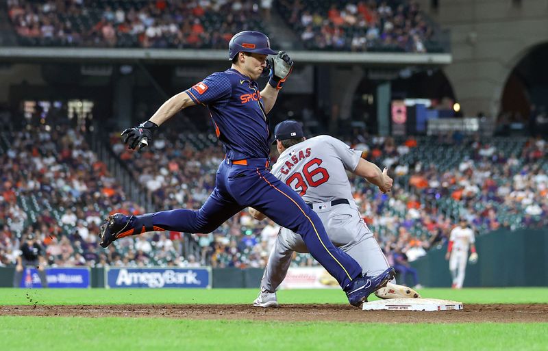 Aug 19, 2024; Houston, Texas, USA; Houston Astros third baseman Shay Whitcomb (10) is safe at first base on an infield single as Boston Red Sox first baseman Triston Casas (36) fields a throw during the seventh inning at Minute Maid Park. Mandatory Credit: Troy Taormina-USA TODAY Sports