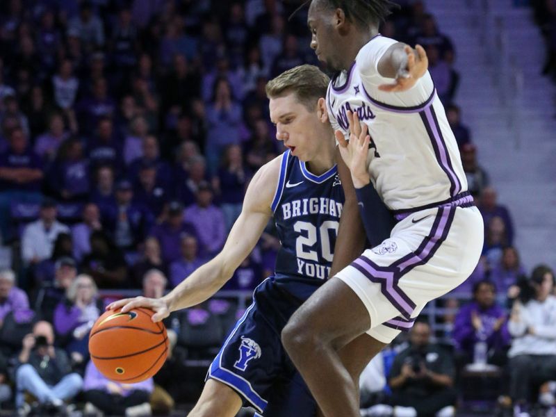 Feb 24, 2024; Manhattan, Kansas, USA; Brigham Young Cougars guard Spencer Johnson (20) dribbles against Kansas State Wildcats forward Arthur Maluma (24) during the second half at Bramlage Coliseum. Mandatory Credit: Scott Sewell-USA TODAY Sports