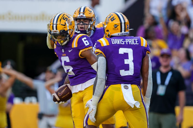 Sep 18, 2021; Baton Rouge, Louisiana, USA;  LSU Tigers wide receiver Deion Smith (6) reacts to making a touchdown against Central Michigan Chippewas during the first half at Tiger Stadium. Mandatory Credit: Stephen Lew-USA TODAY Sports