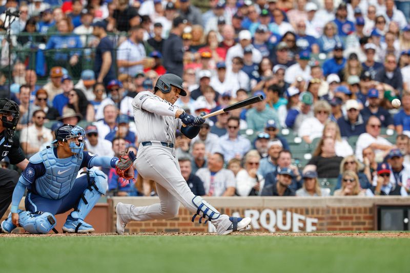 Sep 6, 2024; Chicago, Illinois, USA; New York Yankees outfielder Juan Soto (22) singles against the Chicago Cubs during the third inning at Wrigley Field. Mandatory Credit: Kamil Krzaczynski-Imagn Images