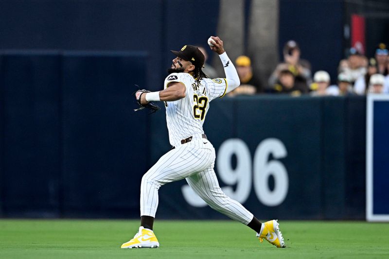 Oct 1, 2024; San Diego, California, USA; San Diego Padres outfielder Fernando Tatis Jr. (23) makes a throw to second base against the Atlanta Braves during the first inning in game one of the Wildcard round for the 2024 MLB Playoffs at Petco Park. Mandatory Credit: Denis Poroy-Imagn Images