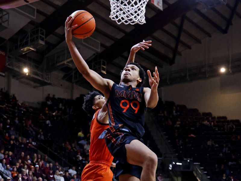 Jan 4, 2025; Blacksburg, Virginia, USA; Miami Hurricanes guard Divine Ugochukwu (99) shoots the ball against Virginia Tech Hokies guard Rodney Brown Jr. (4) during the second half at Cassell Coliseum. Mandatory Credit: Peter Casey-Imagn Images