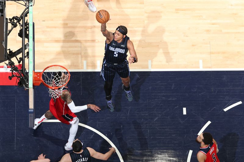 WASHINGTON, DC -? MARCH 6:  Paolo Banchero #5 of the Orlando Magic goes to the basket during the game on March 6, 2024 at Capital One Arena in Washington, DC. NOTE TO USER: User expressly acknowledges and agrees that, by downloading and or using this Photograph, user is consenting to the terms and conditions of the Getty Images License Agreement. Mandatory Copyright Notice: Copyright 2024 NBAE (Photo by Stephen Gosling/NBAE via Getty Images)