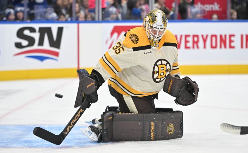 Dec 2, 2023; Toronto, Ontario, CAN; Boston Bruins goalie Linus Ullmark (35) warms up before playing the Toronto Maple Leafs at Scotiabank Arena. Mandatory Credit: Dan Hamilton-USA TODAY Sports