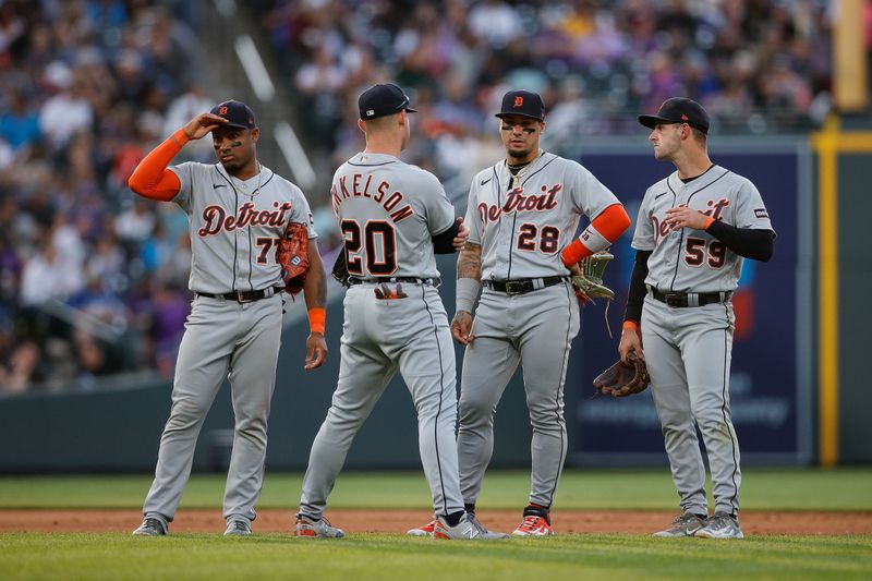 Jun 30, 2023; Denver, Colorado, USA; Detroit Tigers third baseman Andy Ibanez (77) and first baseman Spencer Torkelson (20) an d shortstop Javier Baez (28) and second baseman Zack Short (59) in the sixth inning against the Colorado Rockies at Coors Field. Mandatory Credit: Isaiah J. Downing-USA TODAY Sports