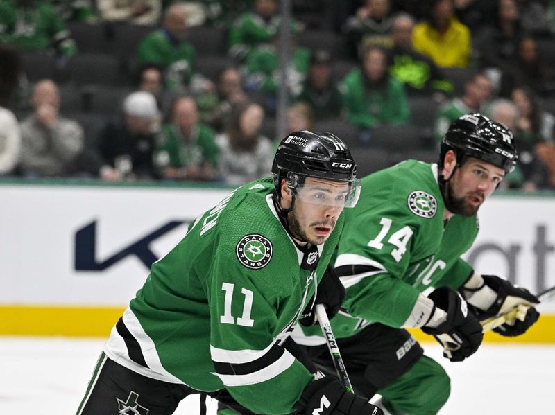 Feb 29, 2024; Dallas, Texas, USA; Dallas Stars center Logan Stankoven (11) and left wing Jamie Benn (14) skates against the Winnipeg Jets during the third period at the American Airlines Center. Mandatory Credit: Jerome Miron-USA TODAY Sports