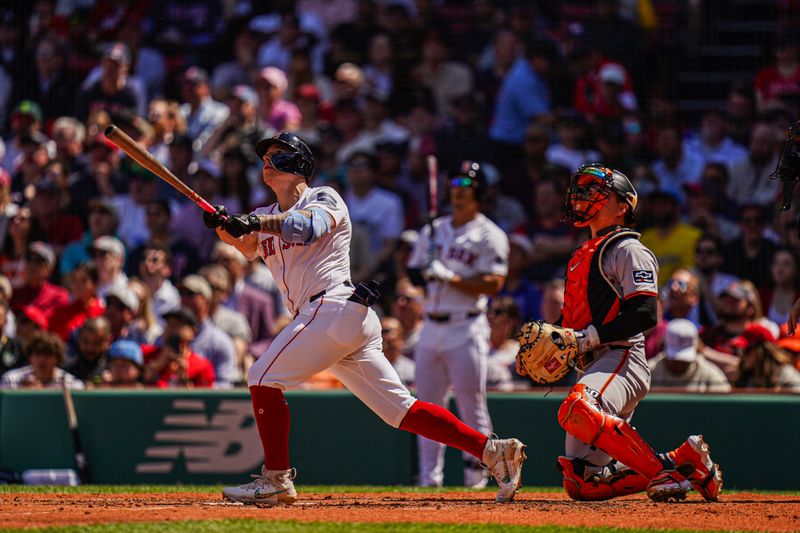 May 2, 2024; Boston, Massachusetts, USA; Boston Red Sox right fielder Tyler O'Neill (17) hits a double to drive in a run against the San Francisco Giants in the third inning at Fenway Park. Mandatory Credit: David Butler II-USA TODAY Sports