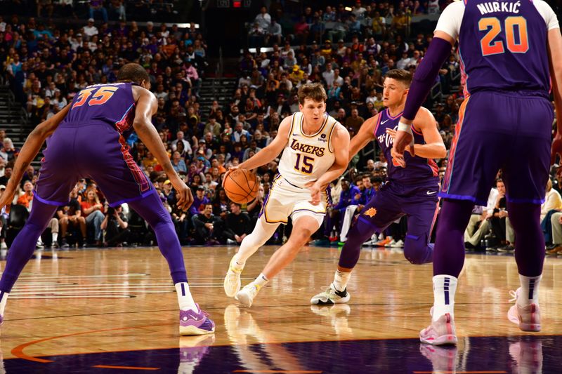 PHOENIX, AZ - FEBRUARY 25: Austin Reaves #15 of the Los Angeles Lakers drives to the basket during the game against the Phoenix Suns on February 25, 2024 at Footprint Center in Phoenix, Arizona. NOTE TO USER: User expressly acknowledges and agrees that, by downloading and or using this photograph, user is consenting to the terms and conditions of the Getty Images License Agreement. Mandatory Copyright Notice: Copyright 2024 NBAE (Photo by Kate Frese/NBAE via Getty Images)