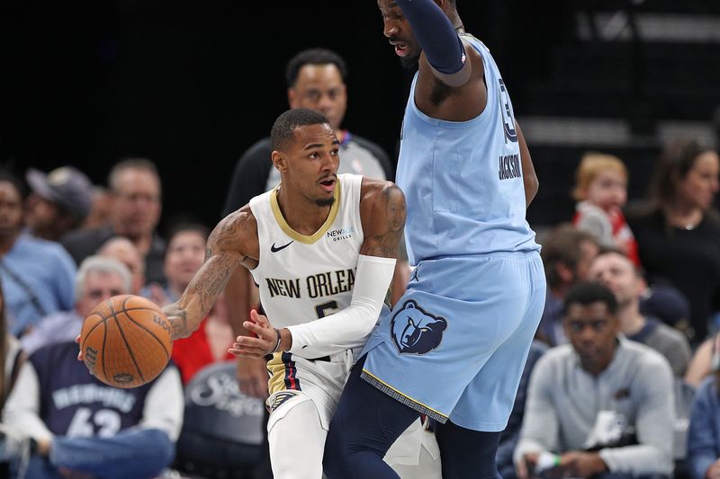 MEMPHIS, TENNESSEE - NOVEMBER 29: Dejounte Murray #5 of the New Orleans Pelicans handles the ball against Jaren Jackson Jr. #13 of the Memphis Grizzlies during the first half of an Emirates NBA Cup game at FedExForum on November 29, 2024 in Memphis, Tennessee. NOTE TO USER: User expressly acknowledges and agrees that, by downloading and or using this photograph, User is consenting to the terms and conditions of the Getty Images License Agreement. (Photo by Justin Ford/Getty Images)