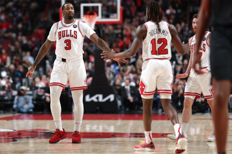 CHICAGO, IL - FEBRUARY 28: Andre Drummond #3 and Ayo Dosunmu #12 of the Chicago Bulls high five during the game against the Cleveland Cavaliers on February 28, 2024 at United Center in Chicago, Illinois. NOTE TO USER: User expressly acknowledges and agrees that, by downloading and or using this photograph, User is consenting to the terms and conditions of the Getty Images License Agreement. Mandatory Copyright Notice: Copyright 2024 NBAE (Photo by Jeff Haynes/NBAE via Getty Images)