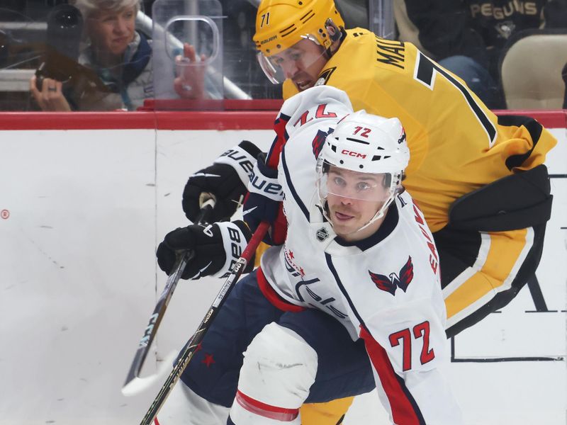 Nov 6, 2025; Pittsburgh, Pennsylvania, USA;  Washington Capitals left wing Anthony Beauvillier (72) moves the puck ahead of Pittsburgh Penguins center Evgeni Malkin (71) during the third period at PPG Paints Arena. Mandatory Credit: Charles LeClaire-Imagn Images
