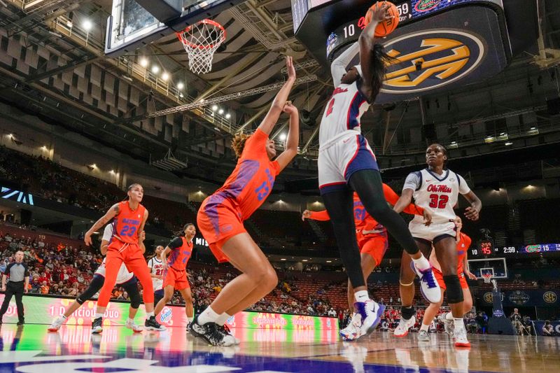 Mar 8, 2024; Greensville, SC, USA; Ole Miss Rebels guard Marquesha Davis (2) shoots over Florida Gators guard Laila Reynolds (13) during the first half at Bon Secours Wellness Arena. Mandatory Credit: Jim Dedmon-USA TODAY Sports