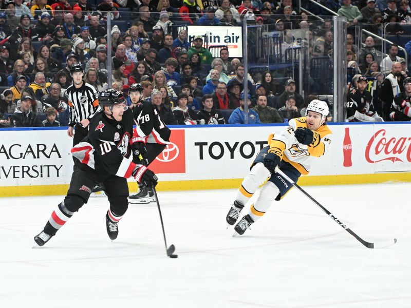Jan 31, 2025; Buffalo, New York, USA; Buffalo Sabres defenseman Henri Jokiharju (10) keeps the puck away from Nashville Predators center Tommy Novak (82) in the first period at the KeyBank Center. Mandatory Credit: Mark Konezny-Imagn Images