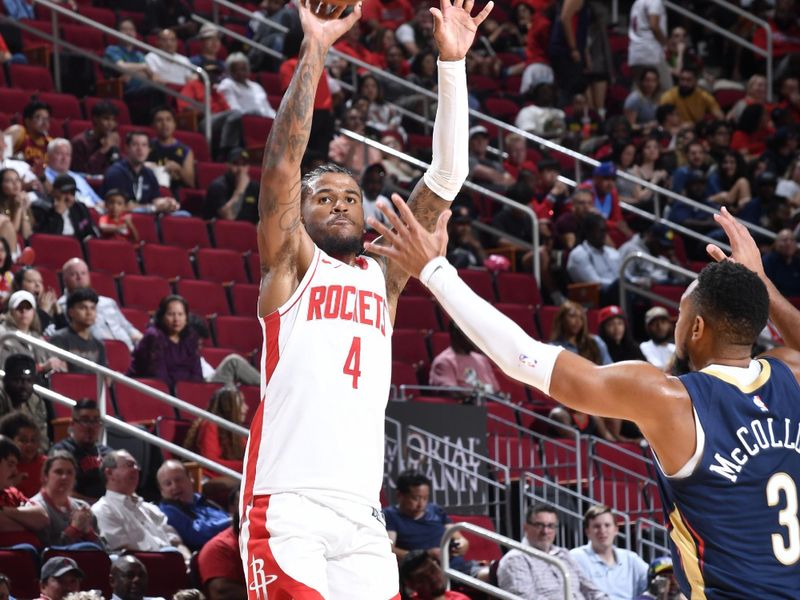 HOUSTON, TX - OCTOBER 15: Jalen Green #4 of the Houston Rockets shoots a three point basket during the game against the New Orleans Pelicans during a NBA preseason game on October 15, 2024 at the Toyota Center in Houston, Texas. NOTE TO USER: User expressly acknowledges and agrees that, by downloading and or using this photograph, User is consenting to the terms and conditions of the Getty Images License Agreement. Mandatory Copyright Notice: Copyright 2024 NBAE (Photo by Logan Riely/NBAE via Getty Images)