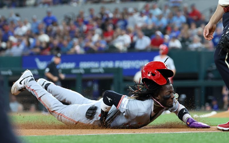 Apr 26, 2024; Arlington, Texas, USA;  Cincinnati Reds shortstop Elly De La Cruz (44) slides safely into third base during the first inning against the Texas Rangers at Globe Life Field. Mandatory Credit: Kevin Jairaj-USA TODAY Sports