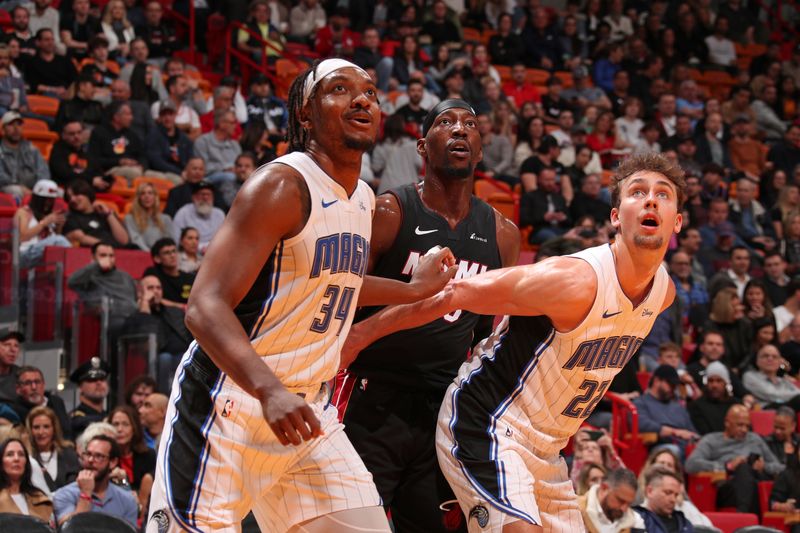 MIAMI, FL - FEBRUARY 6: Wendell Carter Jr. #34 and Franz Wagner #22 of the Orlando Magic box out during the game against the Miami Heat on February 6, 2024 at Kaseya Center in Miami, Florida. NOTE TO USER: User expressly acknowledges and agrees that, by downloading and or using this Photograph, user is consenting to the terms and conditions of the Getty Images License Agreement. Mandatory Copyright Notice: Copyright 2024 NBAE (Photo by Issac Baldizon/NBAE via Getty Images)