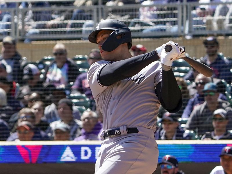 Apr 26, 2023; Minneapolis, Minnesota, USA; New York Yankees designated hitter Aaron Judge (99) hits a three-run RBI double against the Minnesota Twins during the second inning at Target Field. Mandatory Credit: Nick Wosika-USA TODAY Sports

