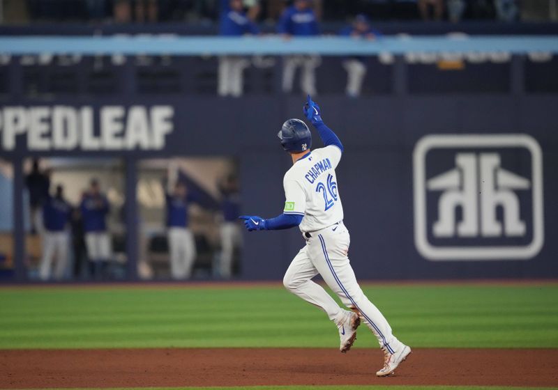 Sep 29, 2023; Toronto, Ontario, CAN; Toronto Blue Jays third baseman Matt Chapman (26) runs the bases and celebrates after hitting a home run against the Tampa Bay Rays during the fifth inning at Rogers Centre. Mandatory Credit: Nick Turchiaro-USA TODAY Sports