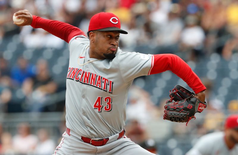 Aug 25, 2024; Pittsburgh, Pennsylvania, USA;  Cincinnati Reds relief pitcher Alexis Díaz (43) pitches against the Pittsburgh Pirates during the ninth inning at PNC Park. Mandatory Credit: Charles LeClaire-USA TODAY Sports