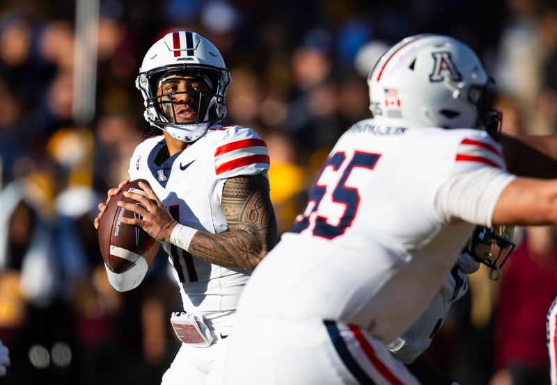 Nov 25, 2023; Tempe, Arizona, USA; Arizona Wildcats quarterback Noah Fifita (11) against the Arizona State Sun Devils in the first half of the Territorial Cup at Mountain America Stadium. Mandatory Credit: Mark J. Rebilas-USA TODAY Sports