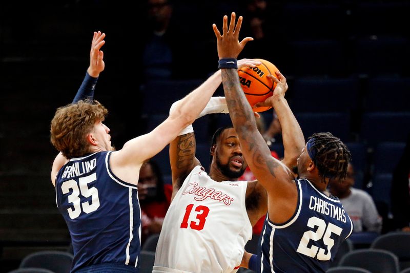 Mar 22, 2024; Memphis, TN, USA;  Houston Cougars forward J'Wan Roberts (13) is trapped by Longwood Lancers forward Jesper Granlund (35) and forward Michael Christmas (25) during the second half in the first round of the 2024 NCAA Tournament at FedExForum. Mandatory Credit: Petre Thomas-USA TODAY Sports