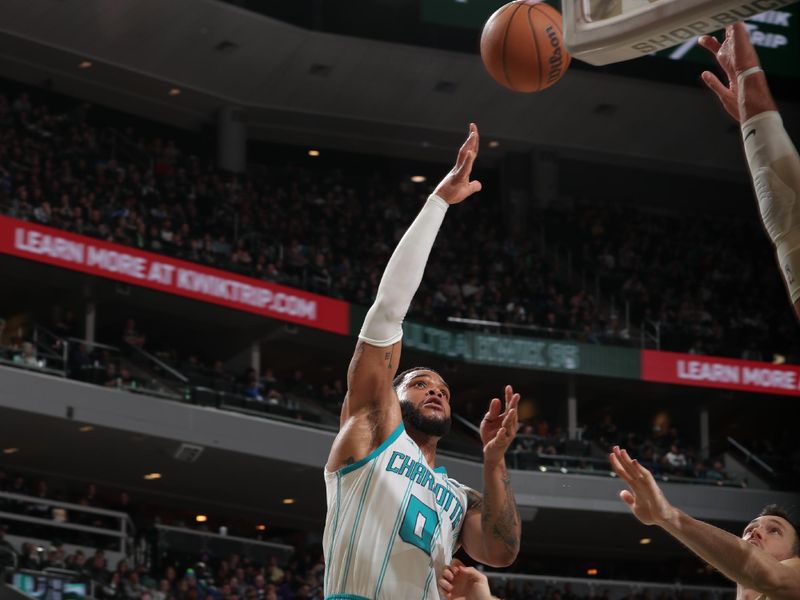 MILWAUKEE, WI - FEBRUARY 9: Miles Bridges #0 of the Charlotte Hornets drives to the basket during the game against the Milwaukee Bucks on February 9, 2024 at the Fiserv Forum Center in Milwaukee, Wisconsin. NOTE TO USER: User expressly acknowledges and agrees that, by downloading and or using this Photograph, user is consenting to the terms and conditions of the Getty Images License Agreement. Mandatory Copyright Notice: Copyright 2024 NBAE (Photo by Gary Dineen/NBAE via Getty Images).