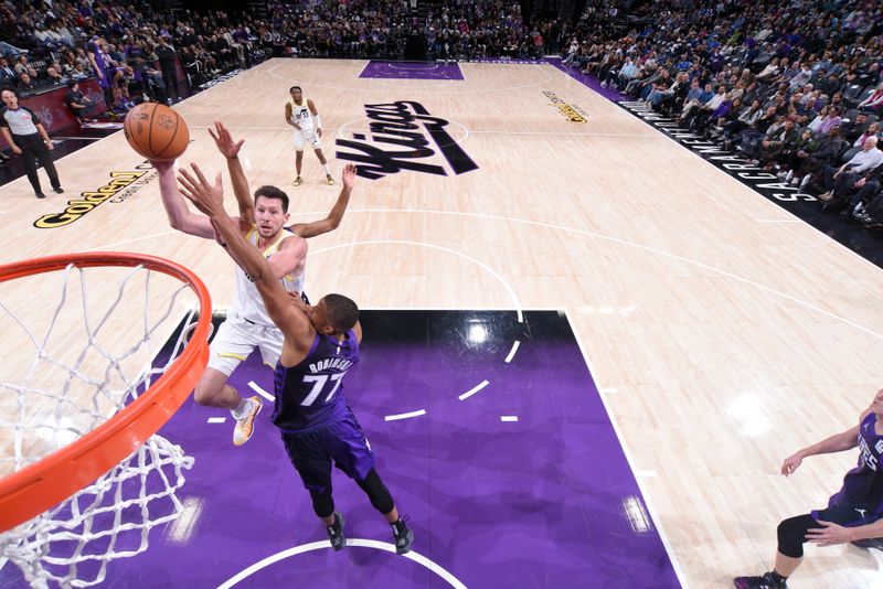 SACRAMENTO, CA - DECEMBER 8: Drew Eubanks #15 of the Utah Jazz drives to the basket during the game against the Sacramento Kings on December 8, 2024 at Golden 1 Center in Sacramento, California. NOTE TO USER: User expressly acknowledges and agrees that, by downloading and or using this Photograph, user is consenting to the terms and conditions of the Getty Images License Agreement. Mandatory Copyright Notice: Copyright 2024 NBAE (Photo by Rocky Widner/NBAE via Getty Images)