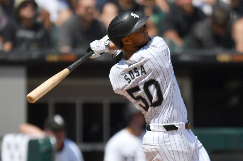 Jun 29, 2024; Chicago, Illinois, USA; Chicago White Sox third base Lenyn Sosa (50) hits a two-run home run during the fifth inning against the Colorado Rockies at Guaranteed Rate Field. Mandatory Credit: Patrick Gorski-USA TODAY Sports