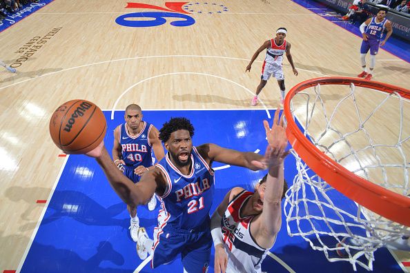 PHILADELPHIA, PA - DECEMBER 11: Joel Embiid #21 of the Philadelphia 76ers drives to the basket during the game against the Washington Wizards on December 11, 2023 at the Wells Fargo Center in Philadelphia, Pennsylvania NOTE TO USER: User expressly acknowledges and agrees that, by downloading and/or using this Photograph, user is consenting to the terms and conditions of the Getty Images License Agreement. Mandatory Copyright Notice: Copyright 2023 NBAE (Photo by Jesse D. Garrabrant/NBAE via Getty Images)