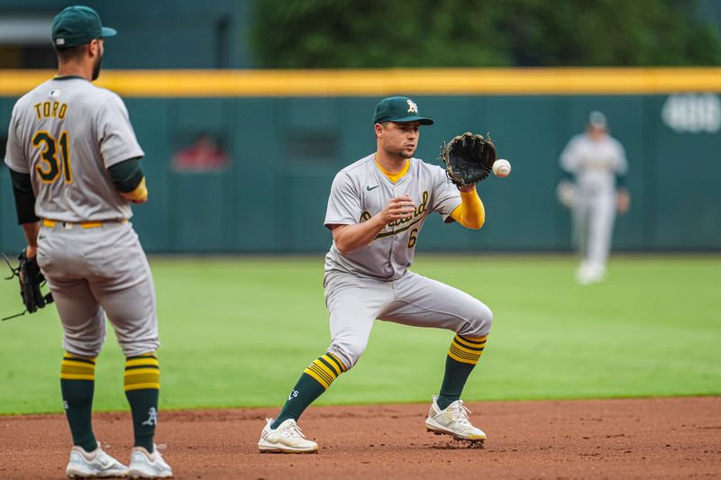 May 31, 2024; Cumberland, Georgia, USA; Oakland Athletics shortstop Aledmys Diaz (6) fields a ball hit by Atlanta Braves third baseman Austin Riley (27) (not shown) during the first inning at Truist Park. Mandatory Credit: Dale Zanine-USA TODAY Sports