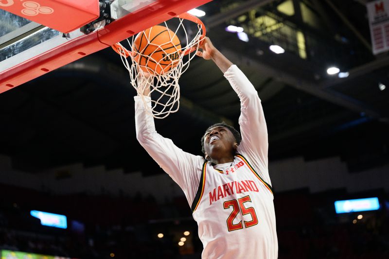 Dec 4, 2024; College Park, Maryland, USA; Maryland Terrapins center Derik Queen (25) dunks the ball during the second half against the Ohio State Buckeyes at Xfinity Center. Mandatory Credit: Reggie Hildred-Imagn Images